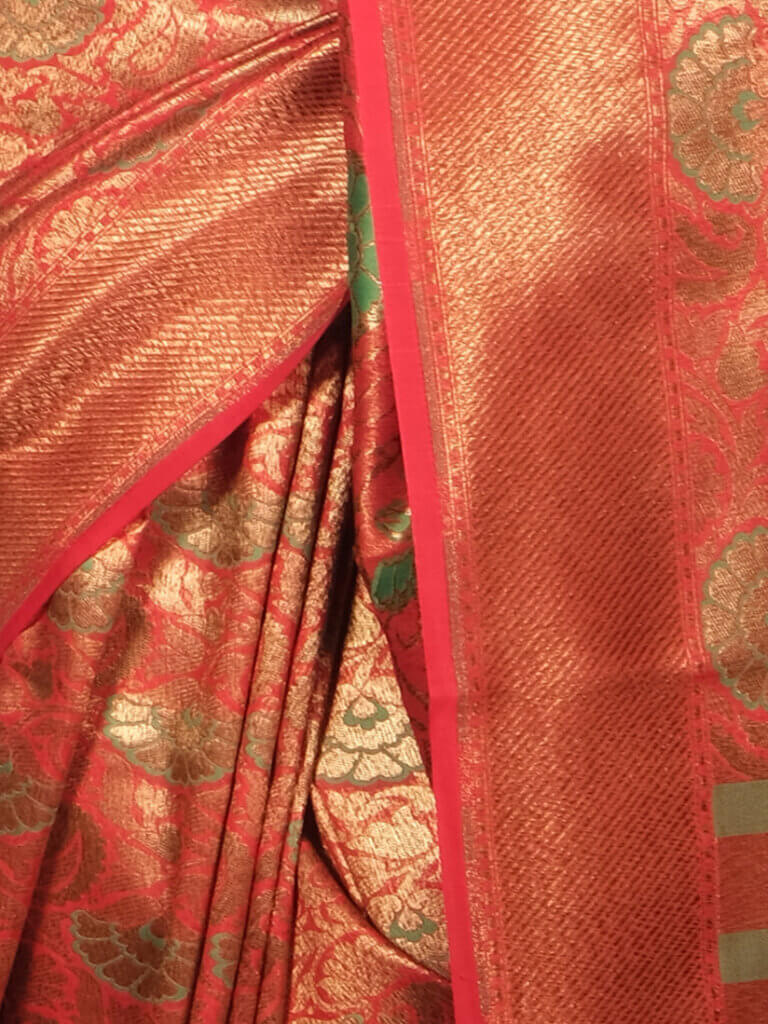 Red Green Woven Design Zari Banarsee Party Wear Semi Silk Saree - Close Up Pose